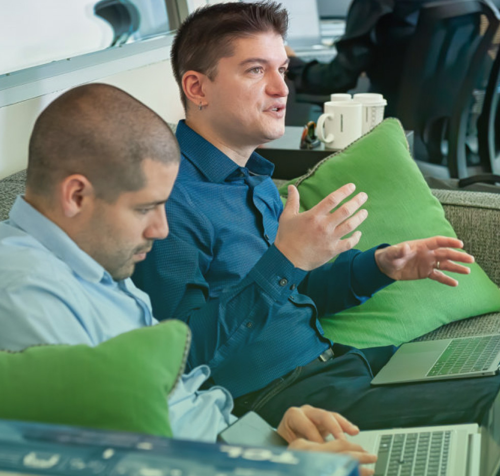 Team of IT professionals collaborating on cybersecurity and managed IT security services in a modern office